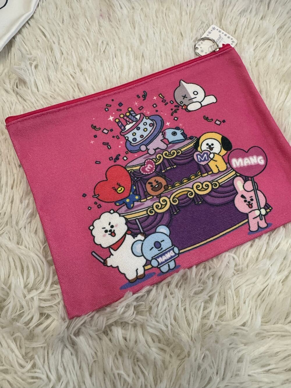 Pink BT21 pencil/make up pouch on a stage with a cake and hearts